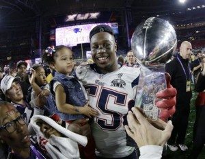 Ayers and his daughter with the Lombardi Trophy in 2015. Photo by David J. Phillip.