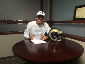 Nick Foles after signing his contract extension on Friday night. Photo via the St. Louis Rams Twitter page: @STLouisRams