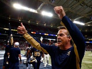 Rams HC Jeff Fisher gives a thumbs-up to the crowd before exiting the field after the Rams victory.