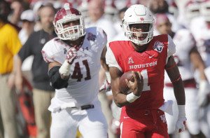 Houston quarterback Greg Ward Jr. rushes in for a touchdown during the first half. Photo via Thomas B. Shea/USA TODAY Sports.