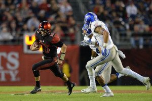 SDSU quarterback Christian Chapman scrambles on Air Force's defense. Photo via Jake Roth/USA TODAY Sports.