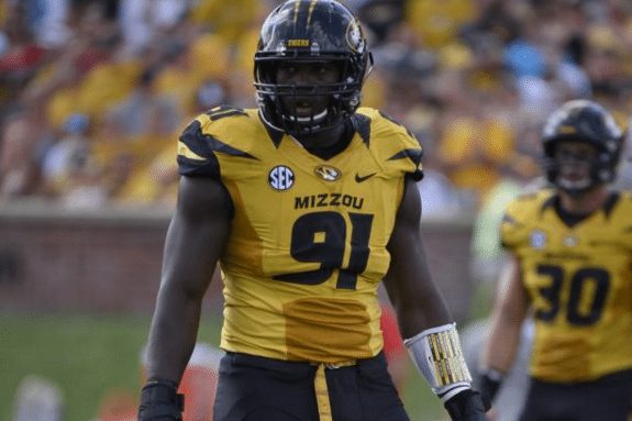 New defensive line coach Chris Wilson will likely inherit DE Charles Harris. Photo by Ed Zurga/Getty Images.