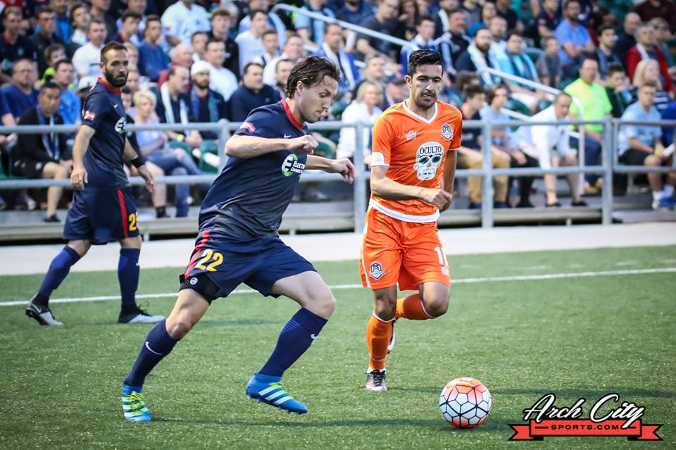 Brandon Barklage looks on as Patrick Doody makes a defensive clearance against Tulsa last Saturday - Mick Lite 