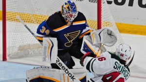 ST. LOUIS, MO - APRIL 16: Jake Allen #34 of the St. Louis Blues defends the net against Jared Spurgeon #46 of the Minnesota Wild in Game One of the Western Conference Quarterfinals during the 2015 NHL Stanley Cup Playoffs on April 16, 2015 at the Scottrade Center in St. Louis, Missouri. (Photo by Jeff Curry/NHLI via Getty Images)